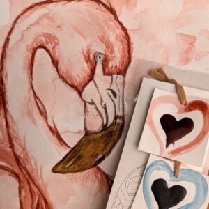 photo d'un dessin de flamant rose fait avec nos pastilles d'aquarelles végétales bleu et rose en forme de cœurs